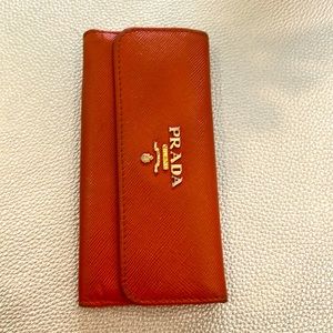 Prada key holder, orange and grained leather